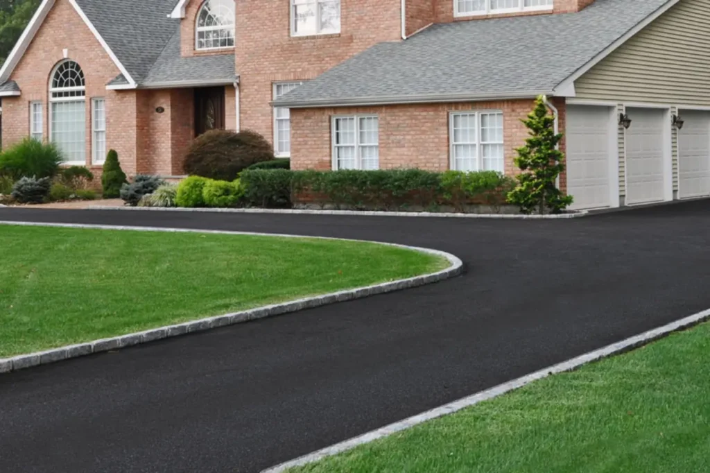 Expert Footpaths installation and resurfacing in Auckland by Asphalt Contractors Auckland showcasing a smooth asphalt pathway along a residential property.