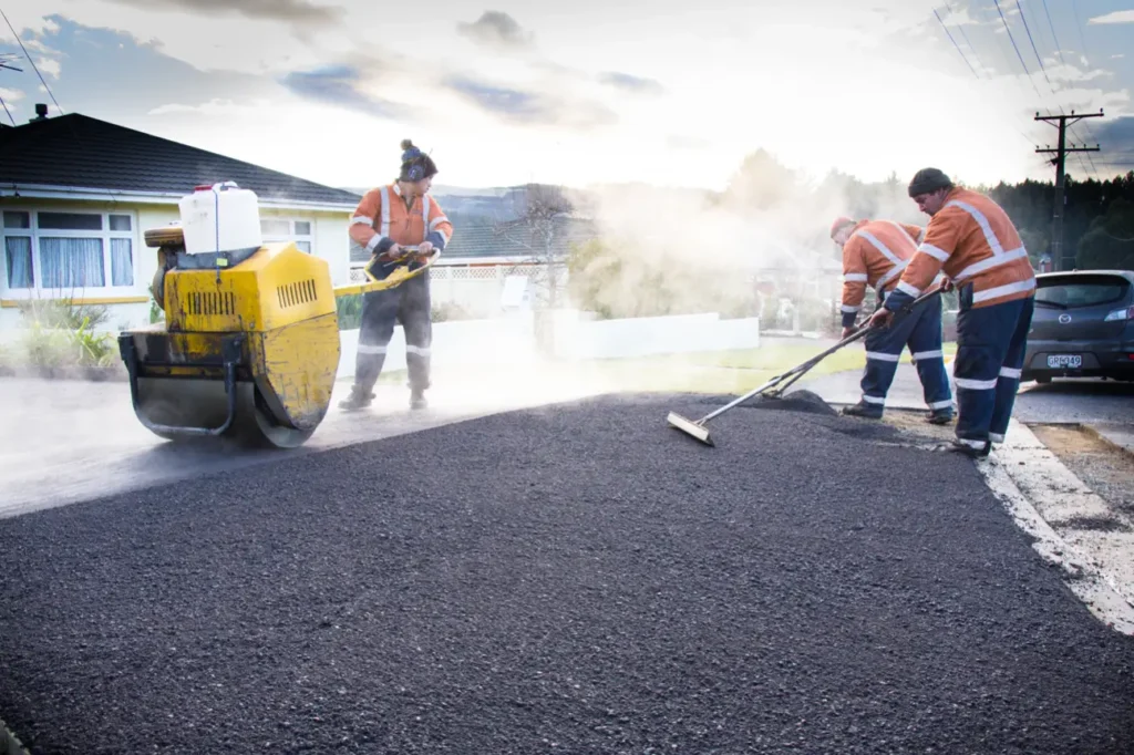 Best Asphalt Contractors Company in Auckland laying and compacting fresh asphalt with professional equipment for a smooth and durable finish.