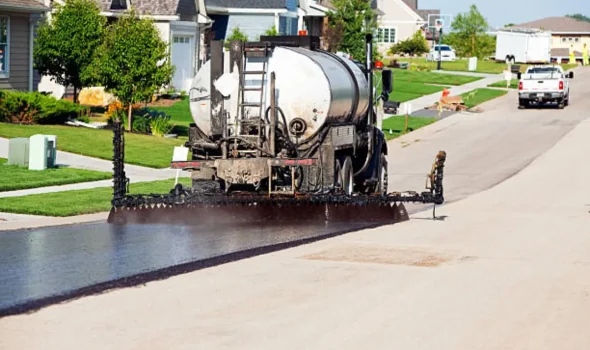 Expert Tar Sealing Service and Quality Assurance by Asphalt Contractors Auckland Asphalt Contractors Auckland performing professional Tar Sealing with advanced spray equipment for expert service and quality assurance.